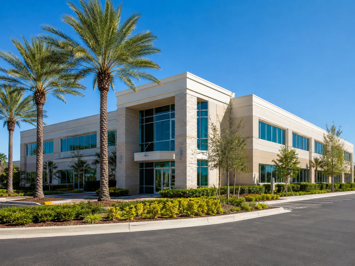 Commercial building with palm trees and landscaped grounds