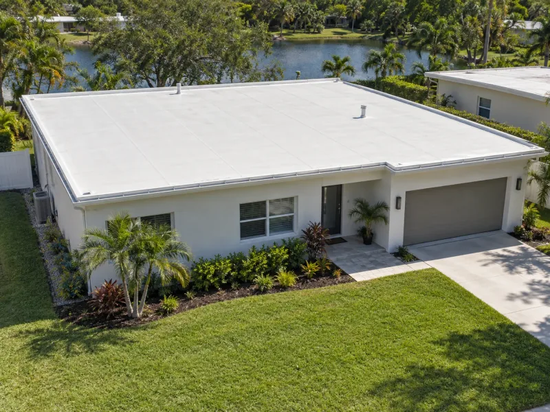 Example of a light-colored low-slope membrane roof on a single-story home